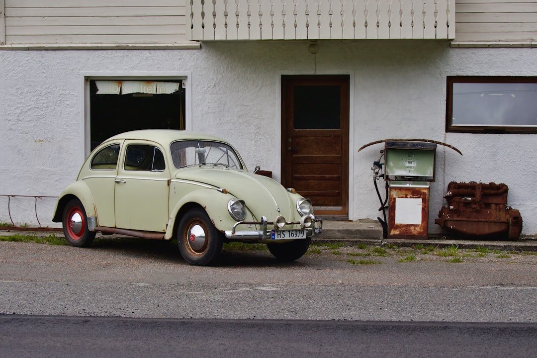 an old car parked in front of a building