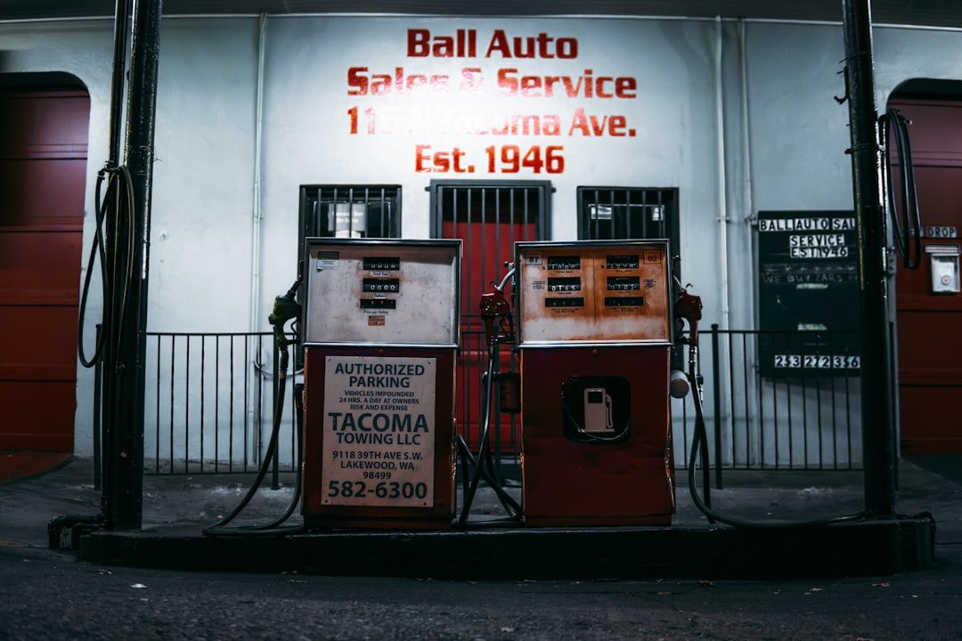 An old fashioned telephone booth in front of a building