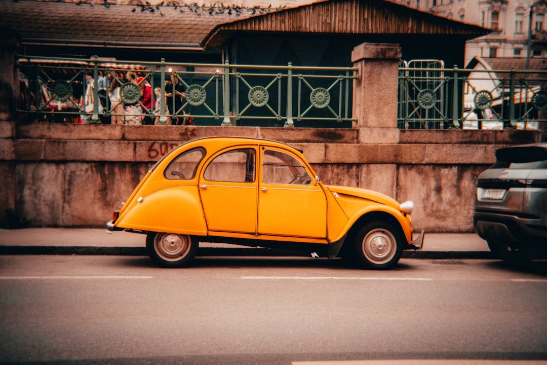 A bright yellow car is parked on the street.
