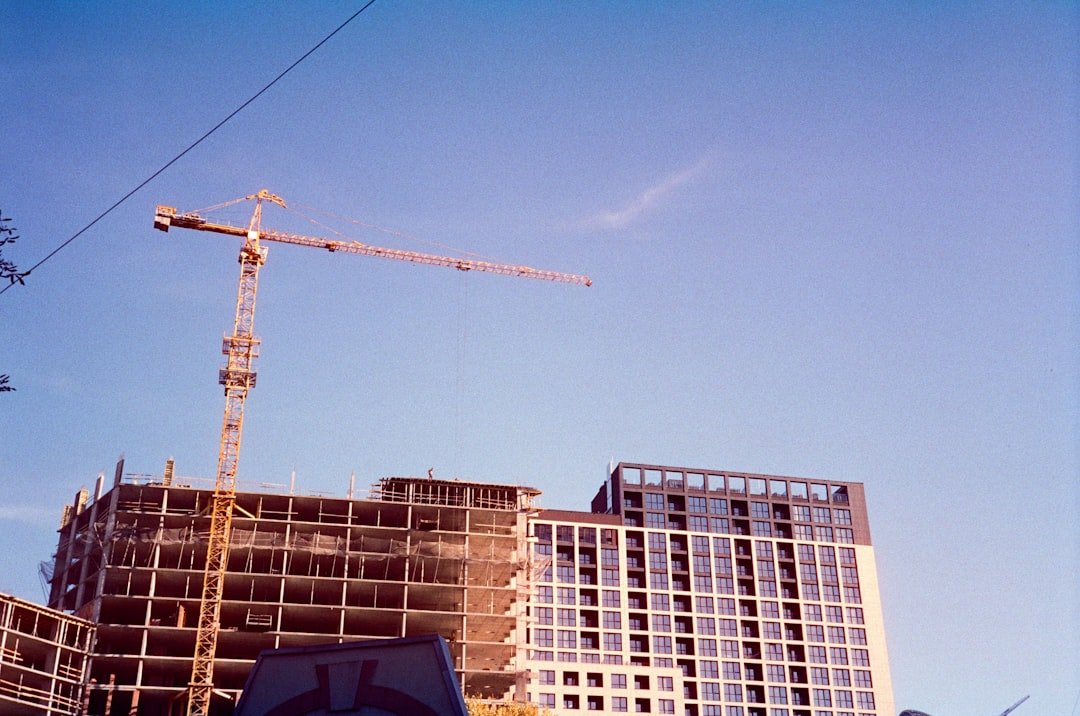 A building under construction with a crane in the background