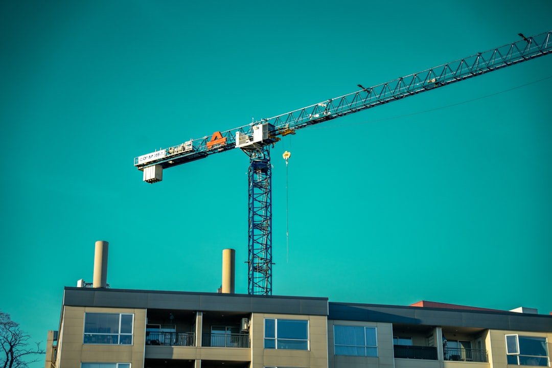 a crane that is on top of a building
