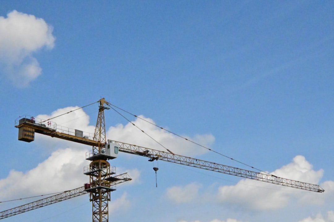 A crane is sitting on top of a building
