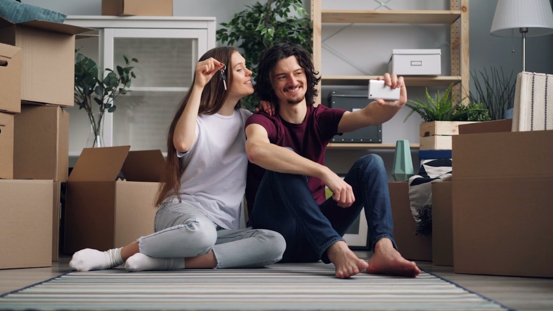 a man and a woman are sitting on the floor