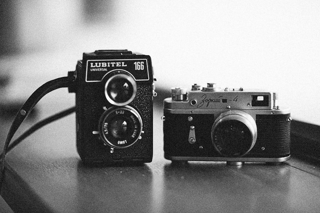 a couple of cameras sitting on top of a table