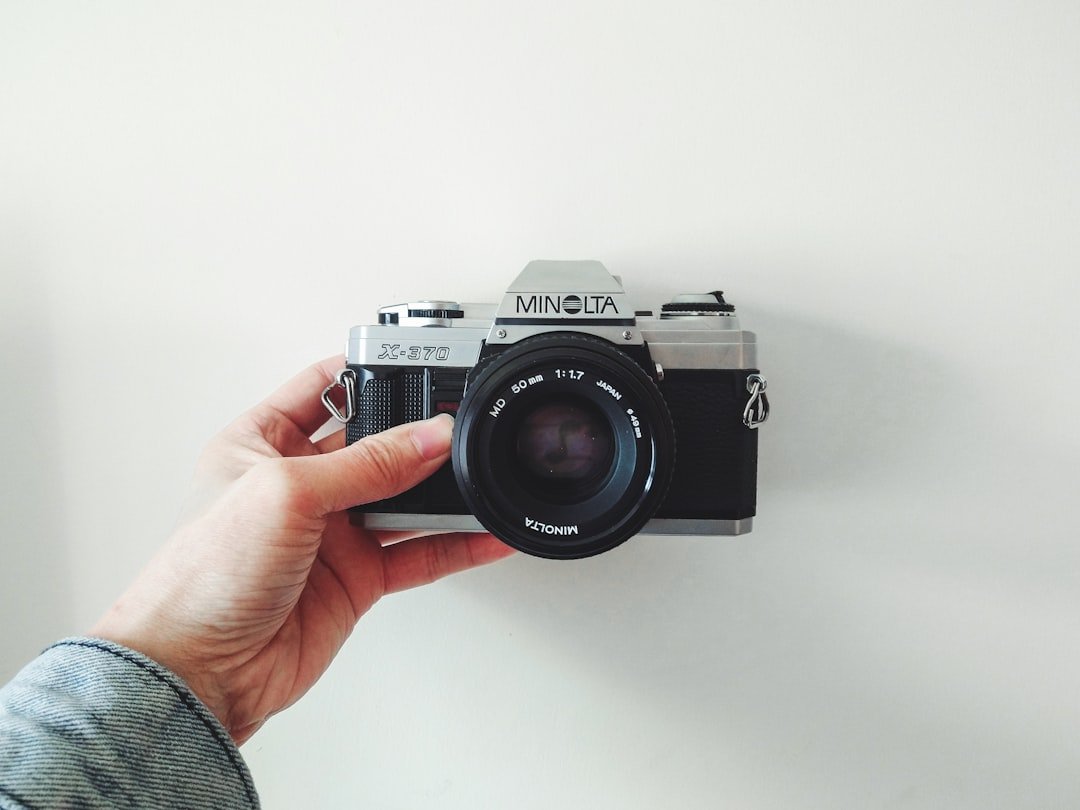 black and silver canon dslr camera