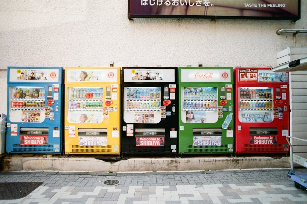 A row of vending machines sitting next to a building