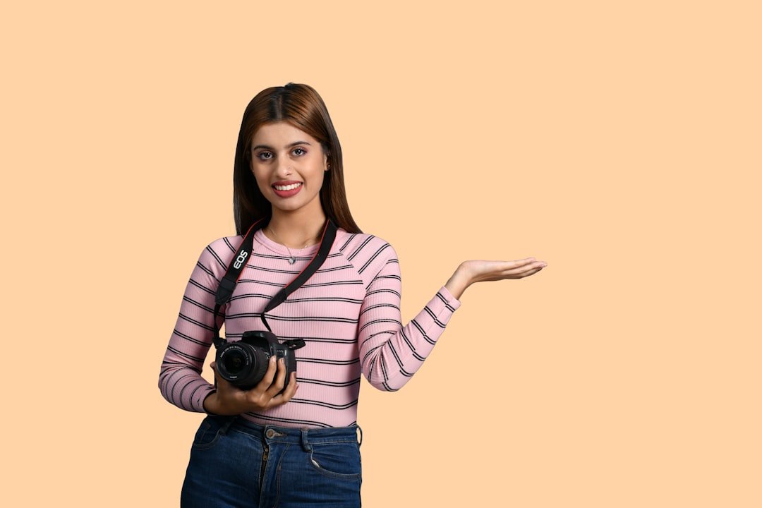 a woman holding a camera
