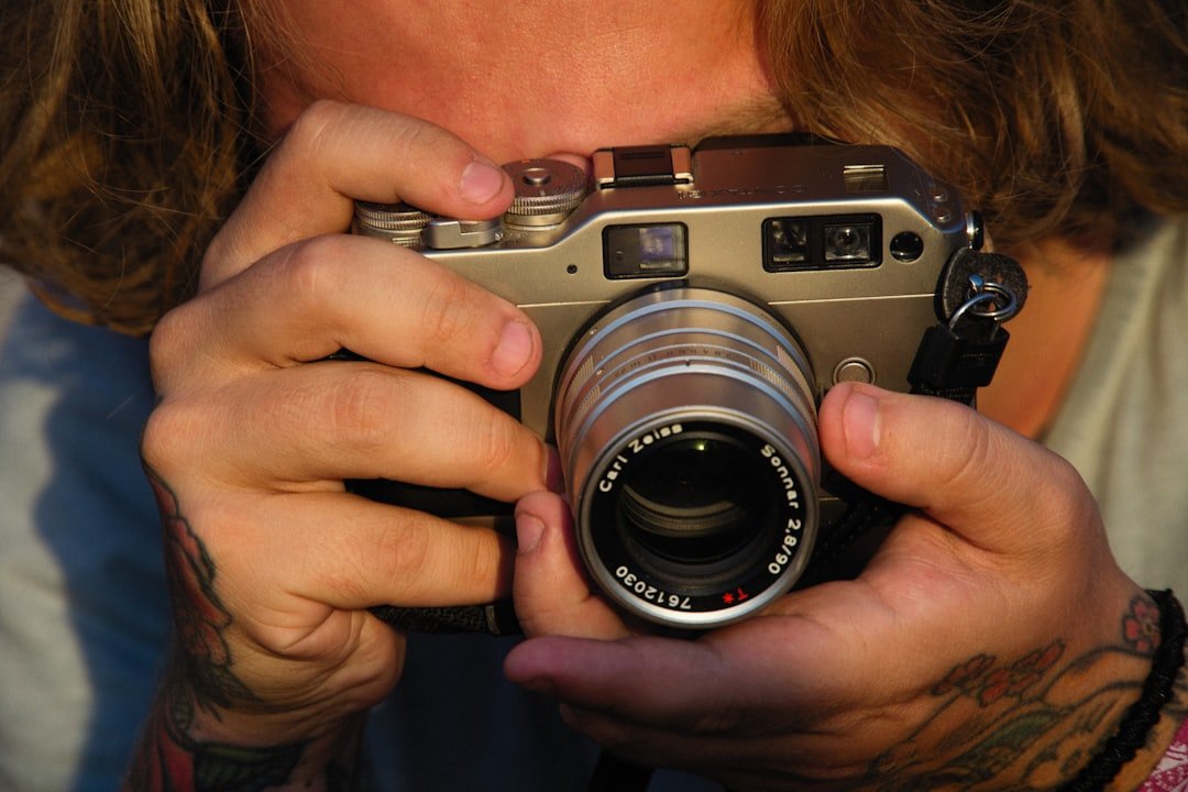 a person holding a camera up to their face