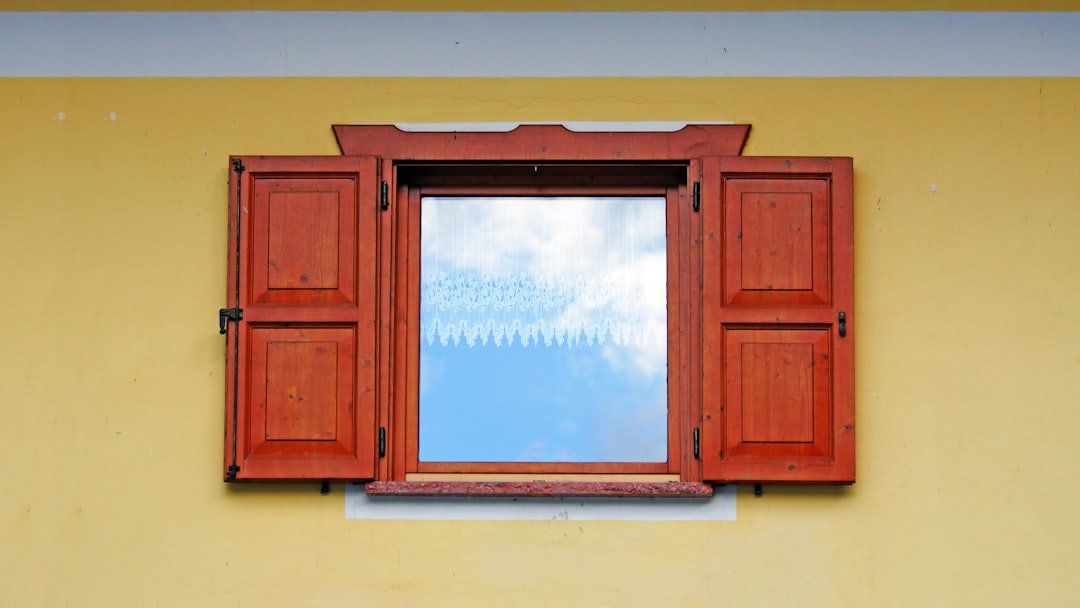 brown wooden framed glass window