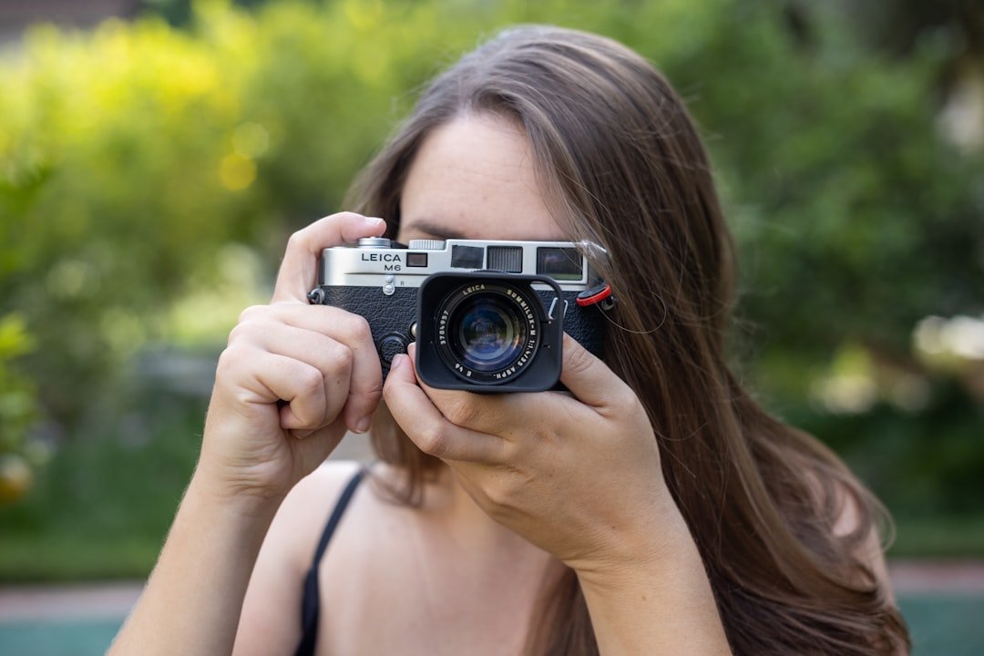 a woman holding a camera