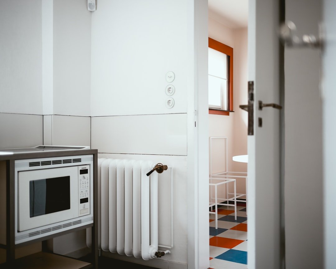 white radiator heater besides white digital vault