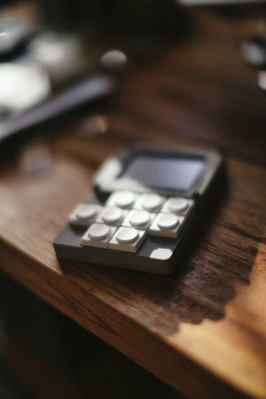 A unique phone with brick-like buttons is shown.