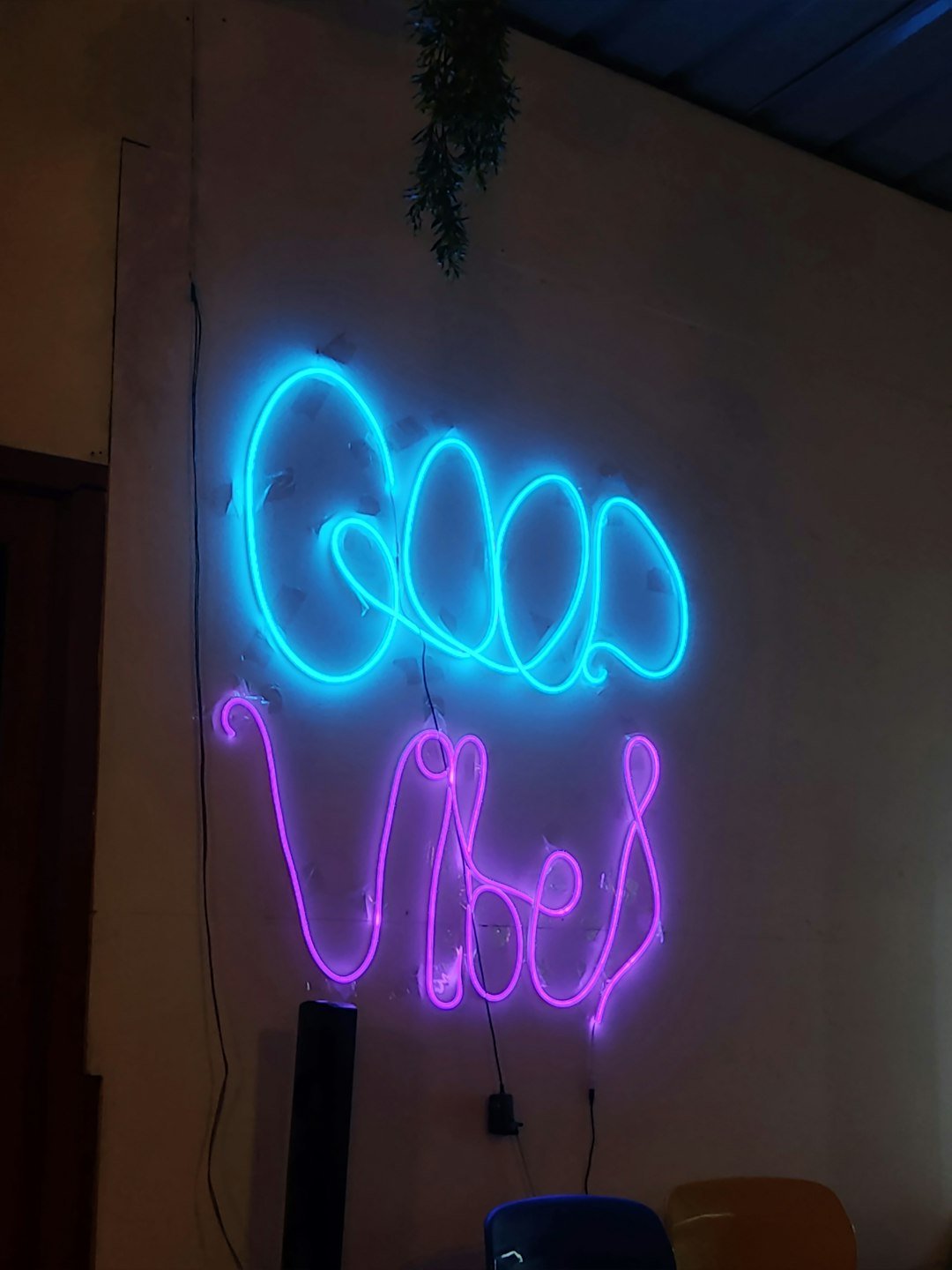 a neon sign that reads good vibe