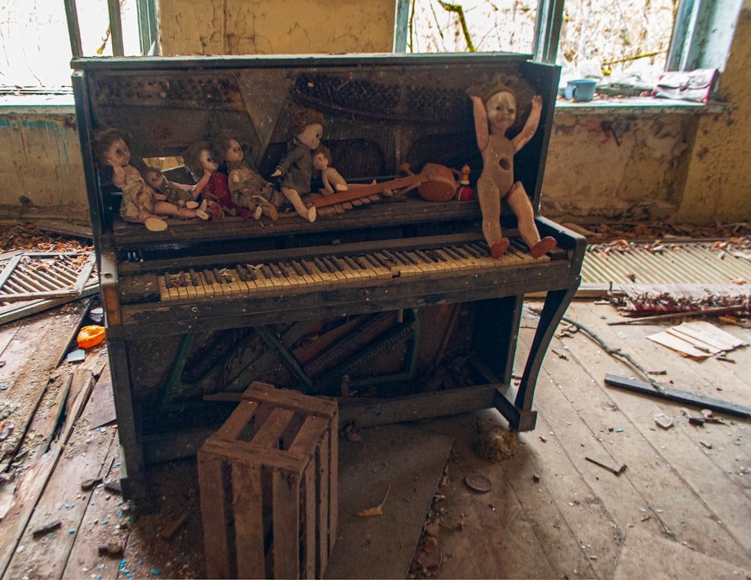 a group of people sitting on a piano