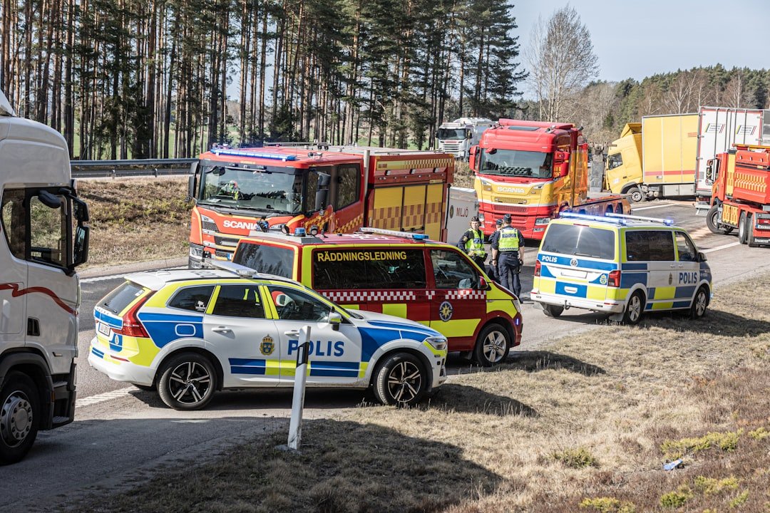 Emergency vehicles responding to a traffic incident on the road.