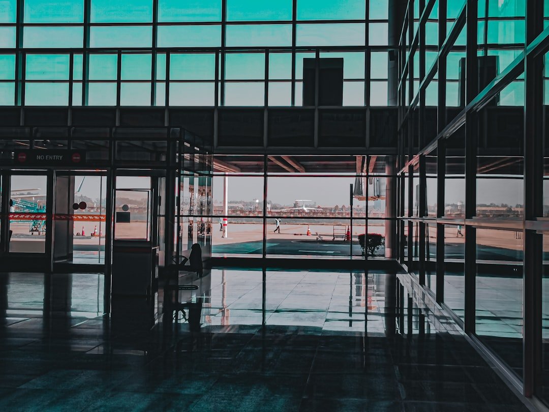 a glass walled building with a large glass window