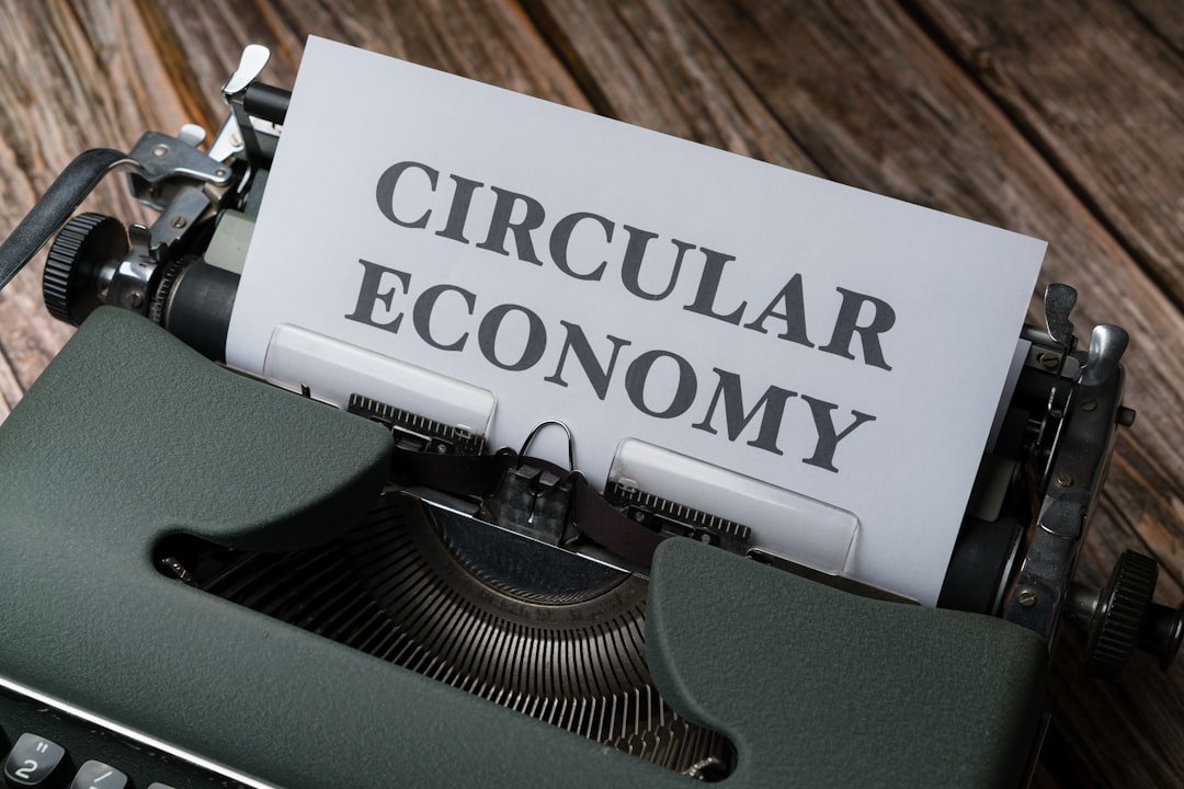 a close up of a typewriter with a paper that reads circular economy