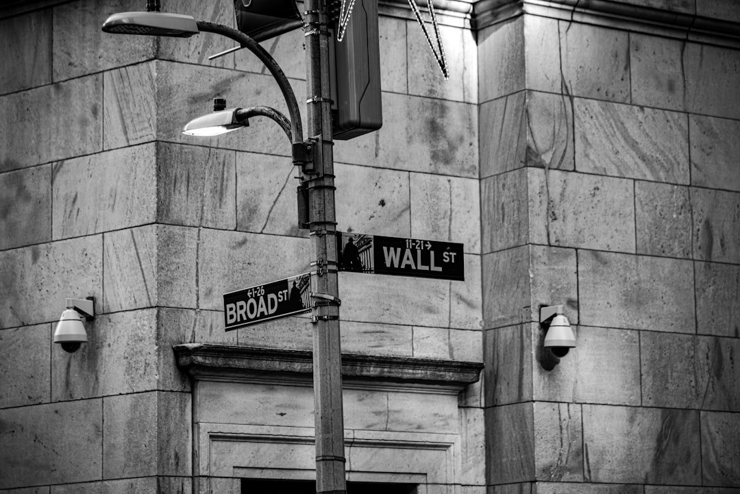 a black and white photo of a street sign